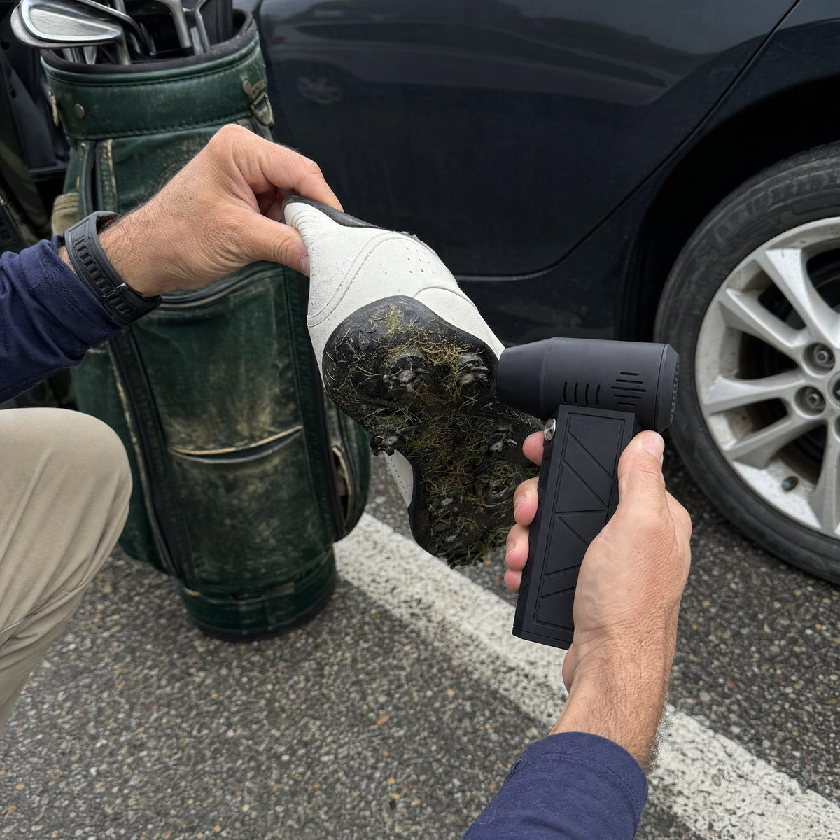 Oryn aimed into grass caught between golf-shoe cleats