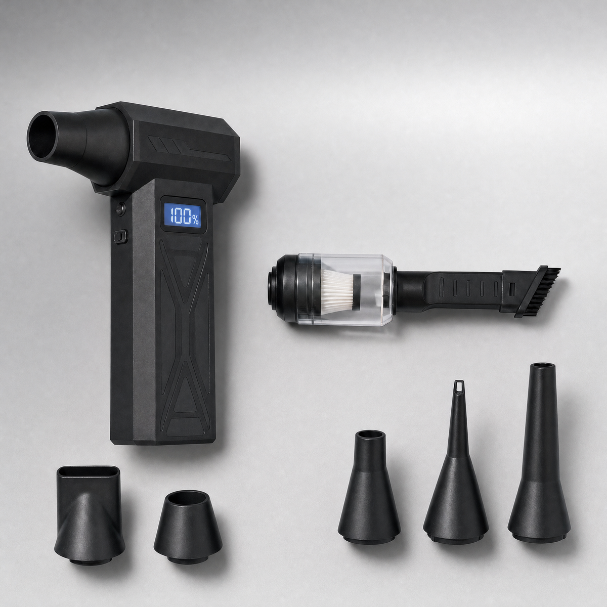 Display blower with illuminated battery screen, assembled dust canister and brush, and five nozzle attachments.
